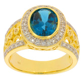 Elegant gold ring featuring a large oval blue topaz stone surrounded by sparkling diamonds, perfect for special occasions.